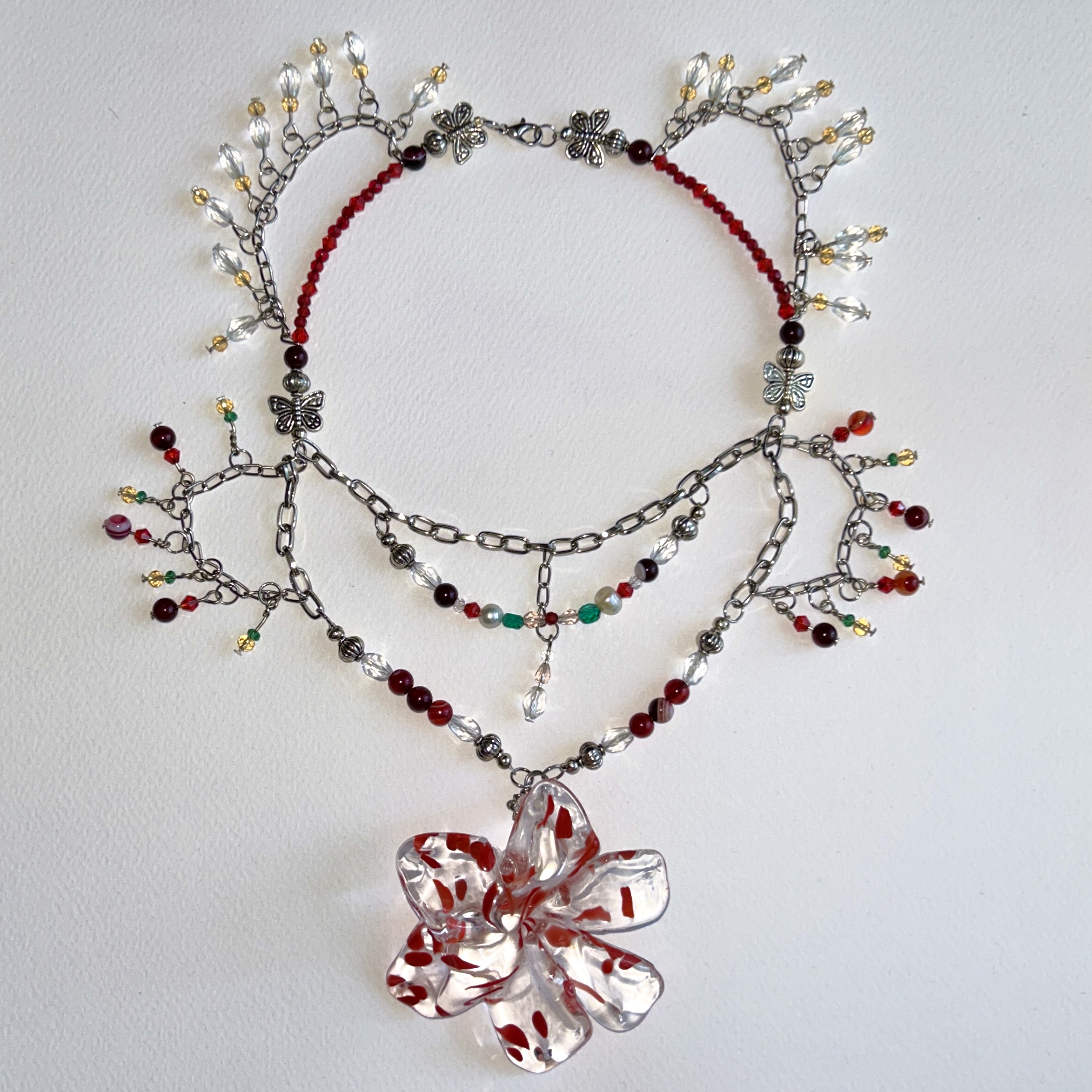 beaded necklace with handmade red and transparent glass flower pendant